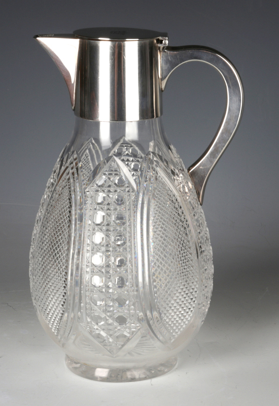 A FINE CUT CRYSTAL AND STERLING SILVER CLARET JUG