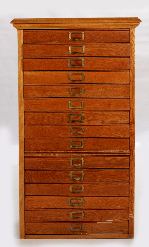 A CIRCA 1900 FIFTEEN DRAWER OAK FILE CABINET