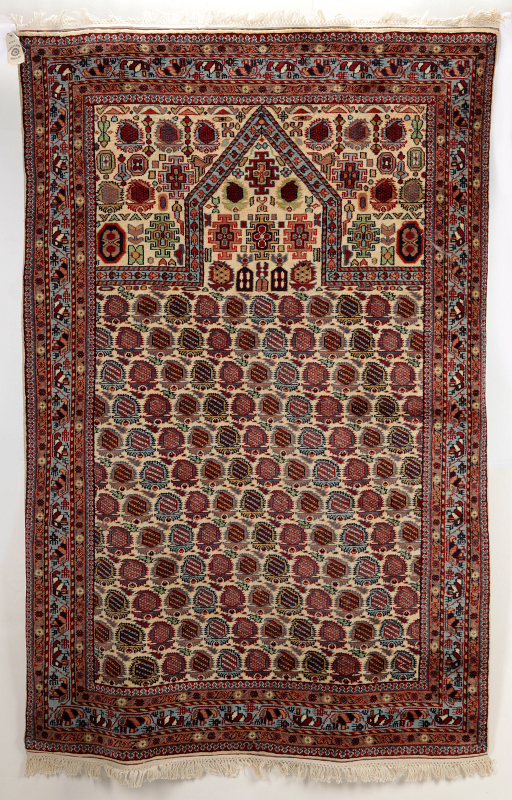 A LATE 20TH CENTURY INDO PERSIAN PRAYER RUG