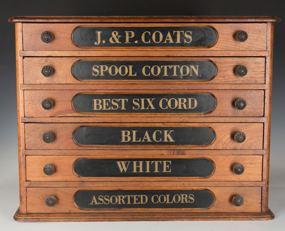 A WALNUT J & P COATS' SIX DRAWER SPOOL CABINET