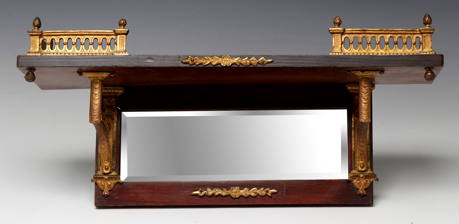 A SMALL MAHOGANY SHELF WITH ORMOLU MOUNTS