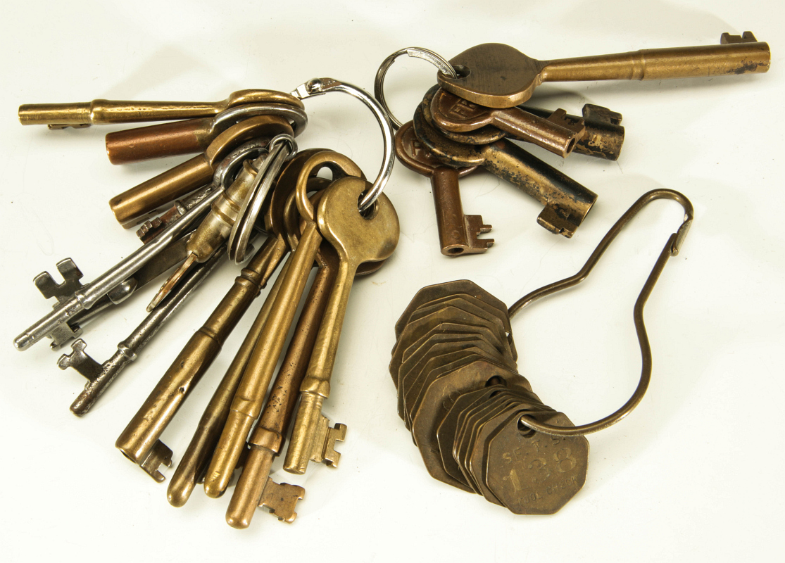 A COLLECTION OF RAILROAD KEYS AND ATSF TOOL CHECKS