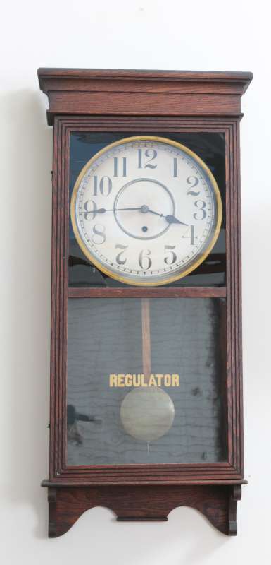 A CIRCA 1900 OAK SESSIONS BOX REGULATOR