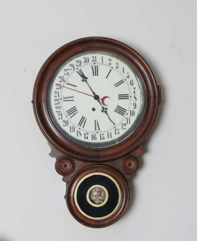 AN ANTIQUE INGRAHAM  'IONIC' STYLE CALENDAR CLOCK