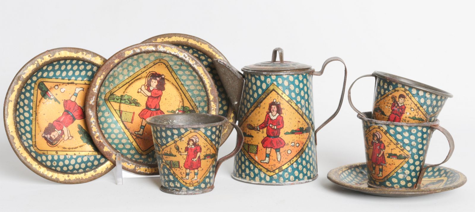A SCARCE TENNIS PLAYING THEME TIN LITHO TEA SET