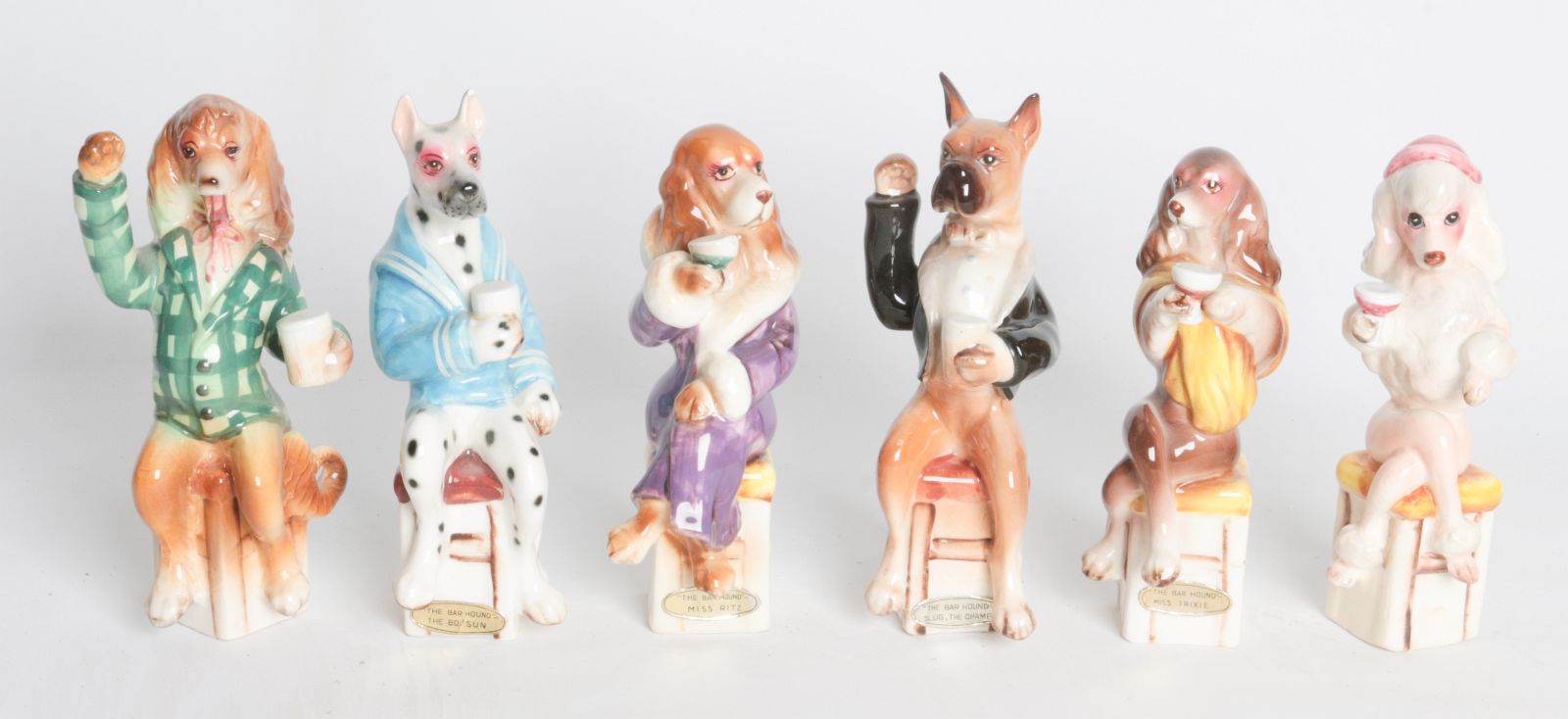 SIX CIRCA 1960 BAR HOUND CERAMIC FIGURES