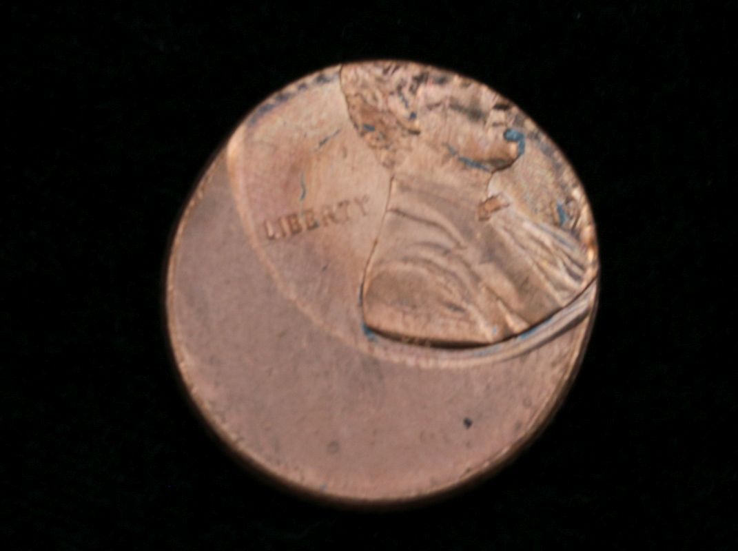 AN OFF CENTER STRIKE LINCOLN MEMORIAL CENT