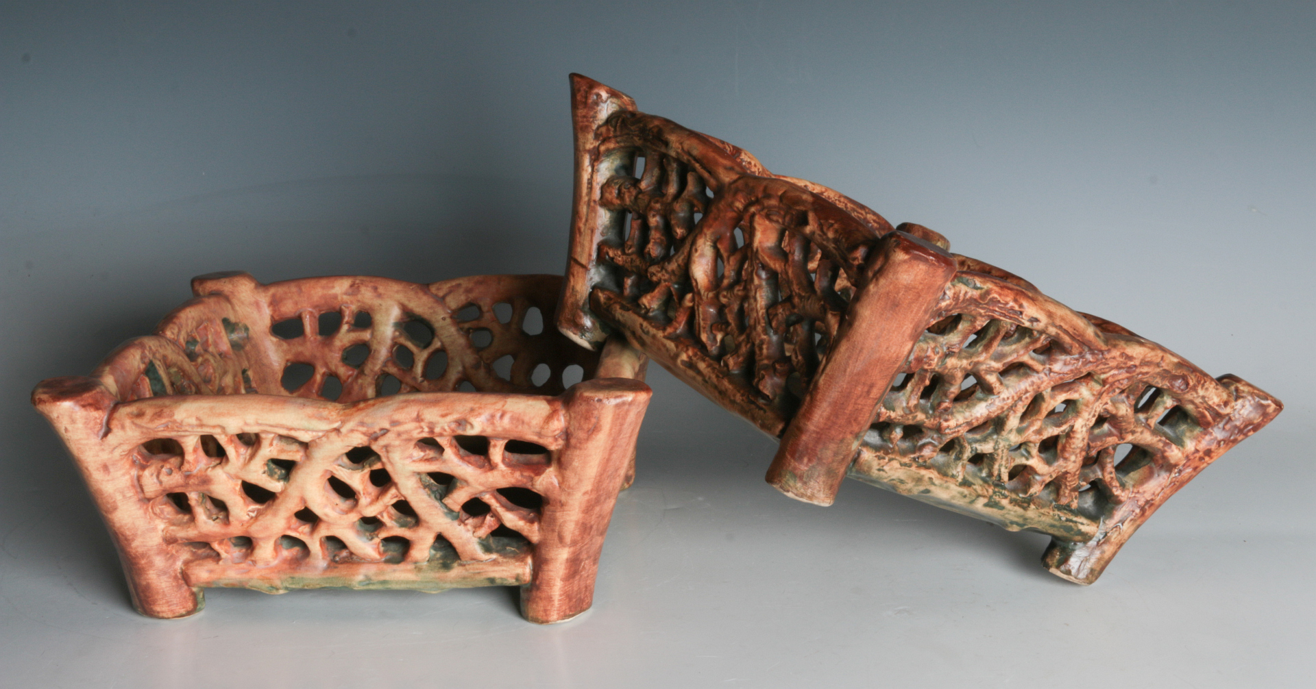 A PAIR OF WELLER 'WOODCRAFT' ART POTTERY BASKETS