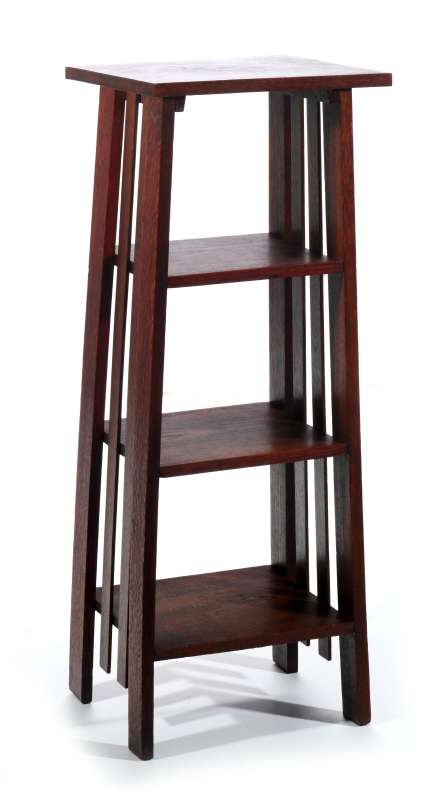 A CIRCA 1900 OAK ARTS AND CRAFTS MAGAZINE STAND