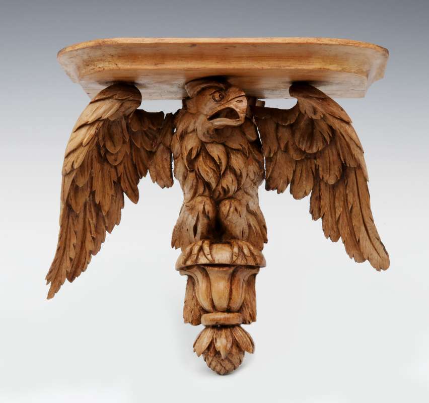 A 19TH C. CARVED PINE FIGURAL EAGLE BRACKET SHELF