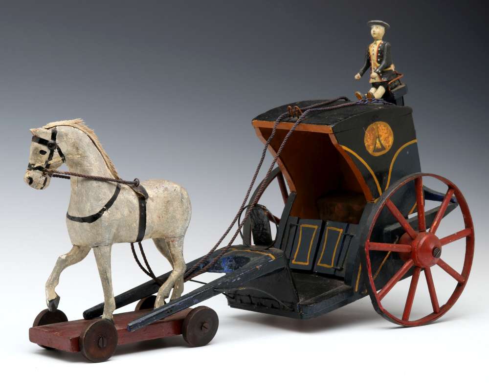 AN EARLY 20C. FOLK ART MODEL OF HORSE DRAWN COACH