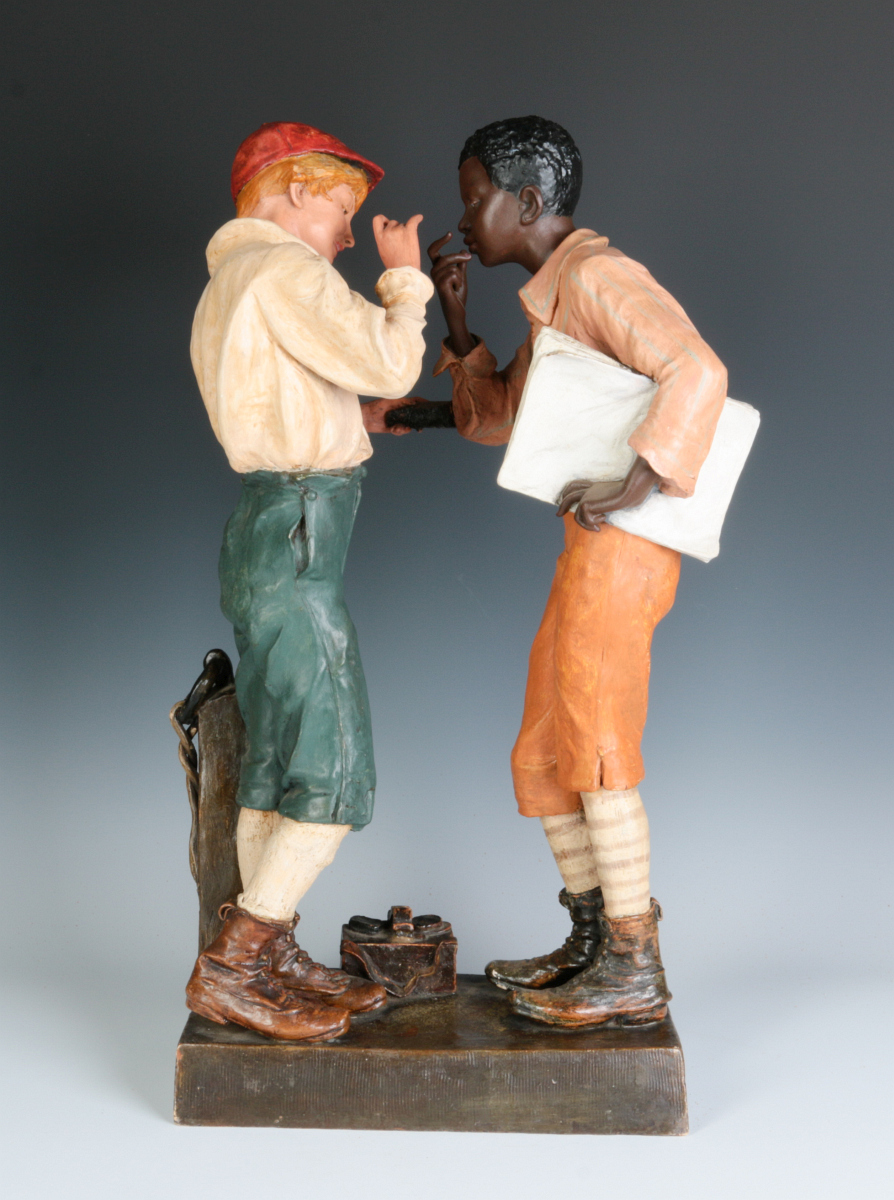 A 20-INCH AUSTRIAN TERRACOTTA FIGURE OF TWO BOYS