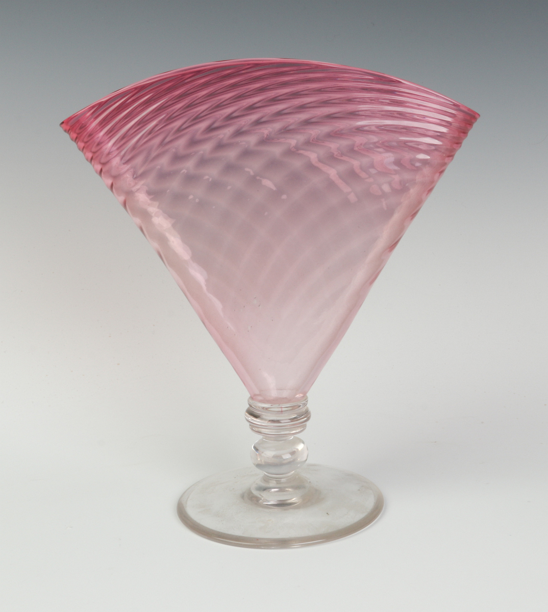 A STEUBEN RUBINA PILLOW FAN VASE WITH OPTIC SWIRL