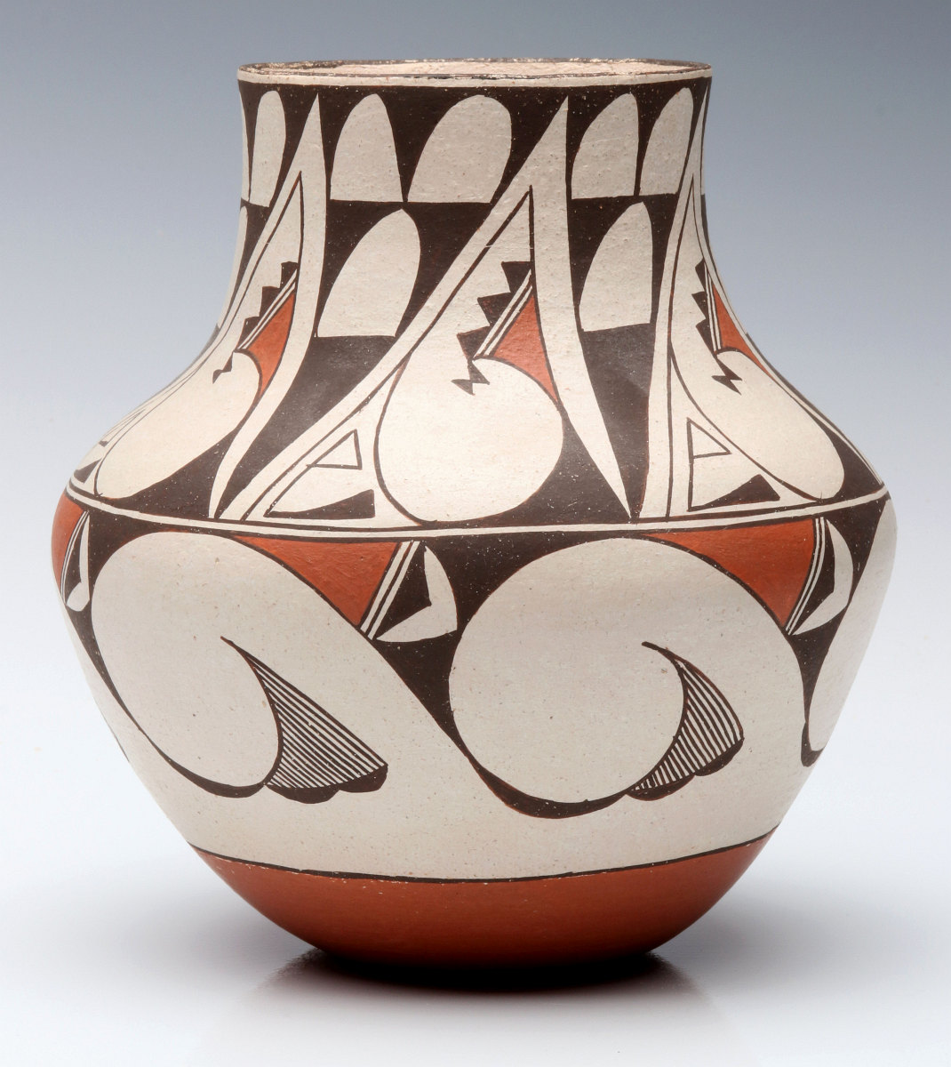 A LAGUNA PUEBLO POTTERY JAR SIGNED E. CHEROMIAH