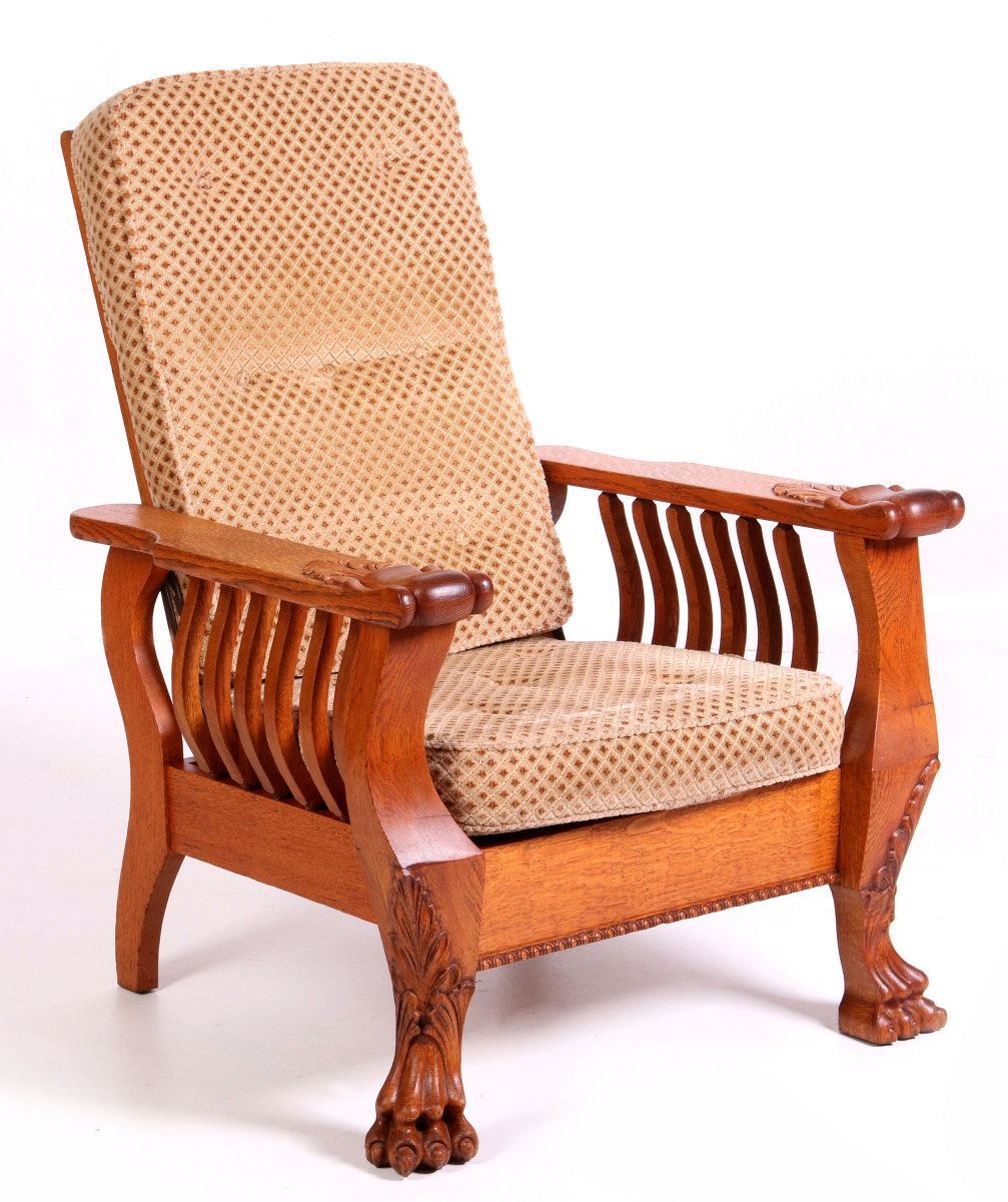 A HEAVY OAK PAW FOOT MORRIS CHAIR CIRCA 1900