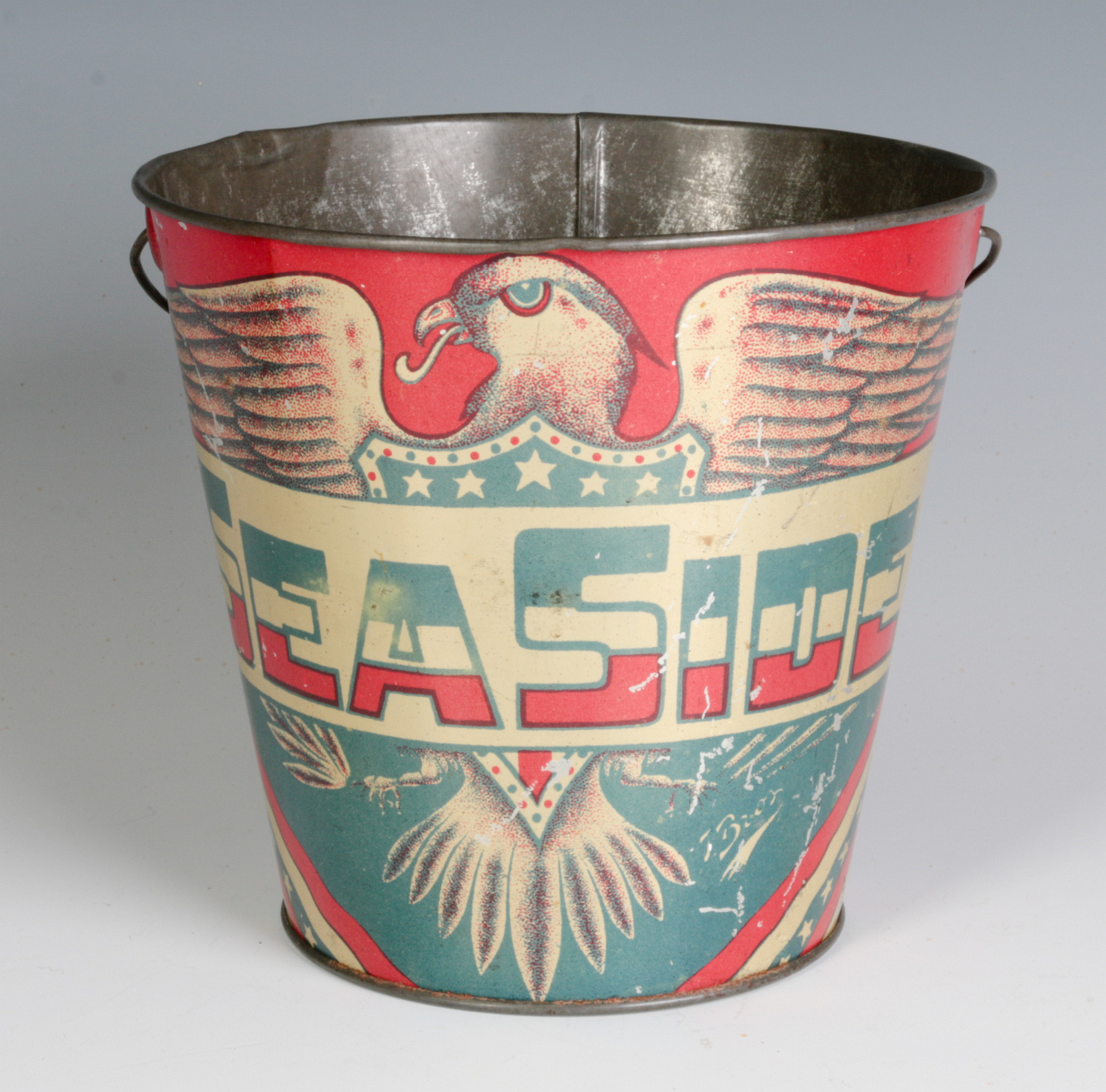 A PATRIOTIC CHILD'S TIN LITHO 'SEASIDE' SAND PAIL