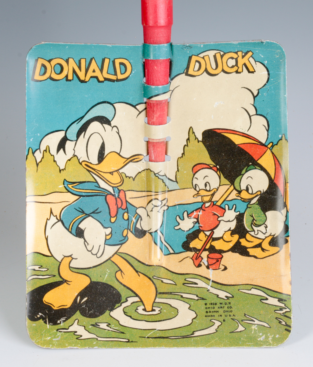 A GOOD DONALD DUCK TIN LITHO SAND SHOVEL DATE 1939