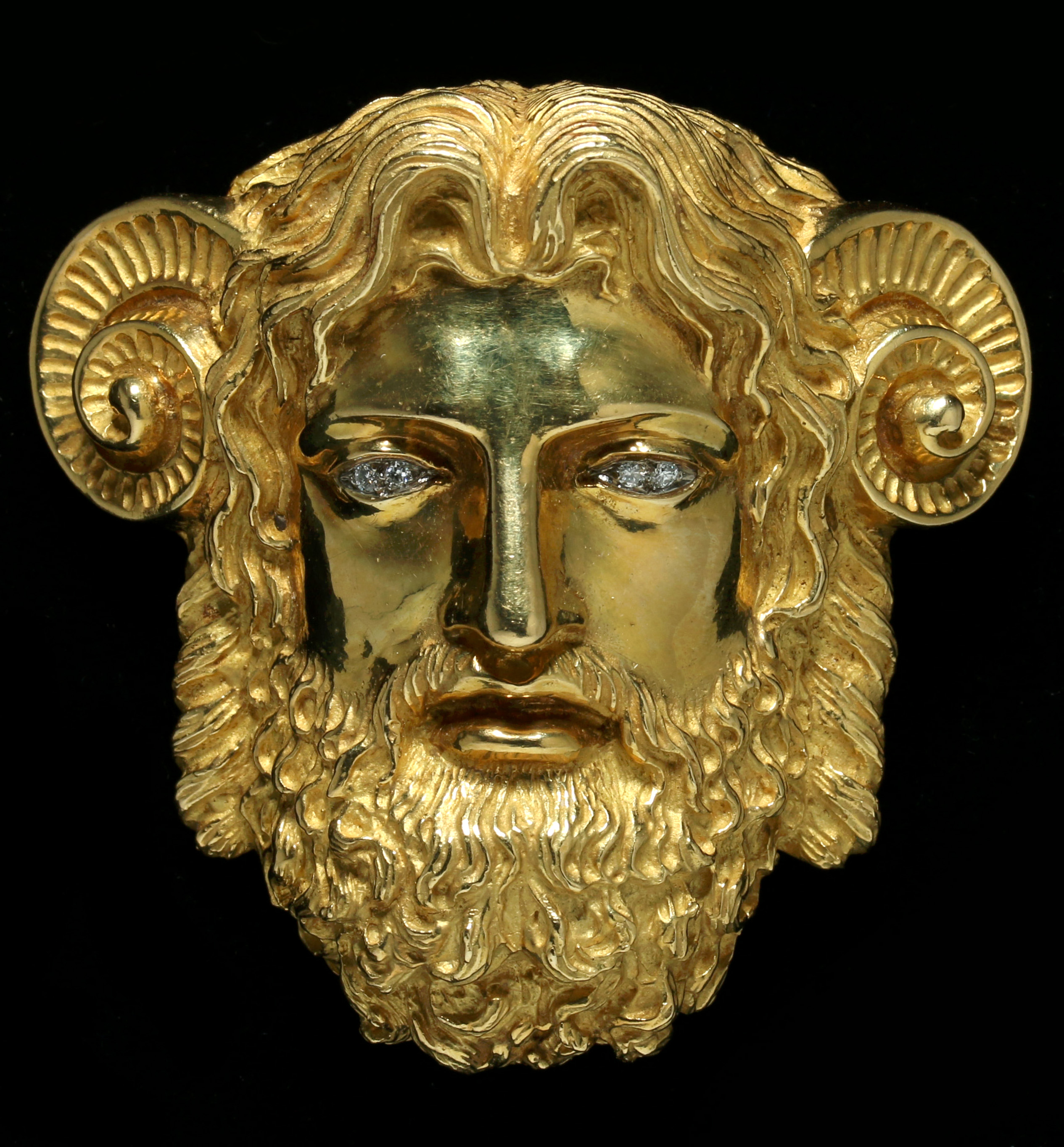 AN 18K GOLD HEAD OF ZEUS AMMON SIGNED WANDER FRANC