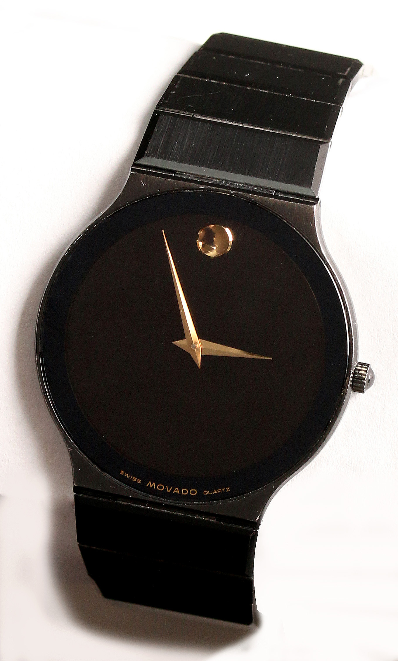 A GENT'S BLACK MOVADO MODEL 84-40-880-A WRIST WATC