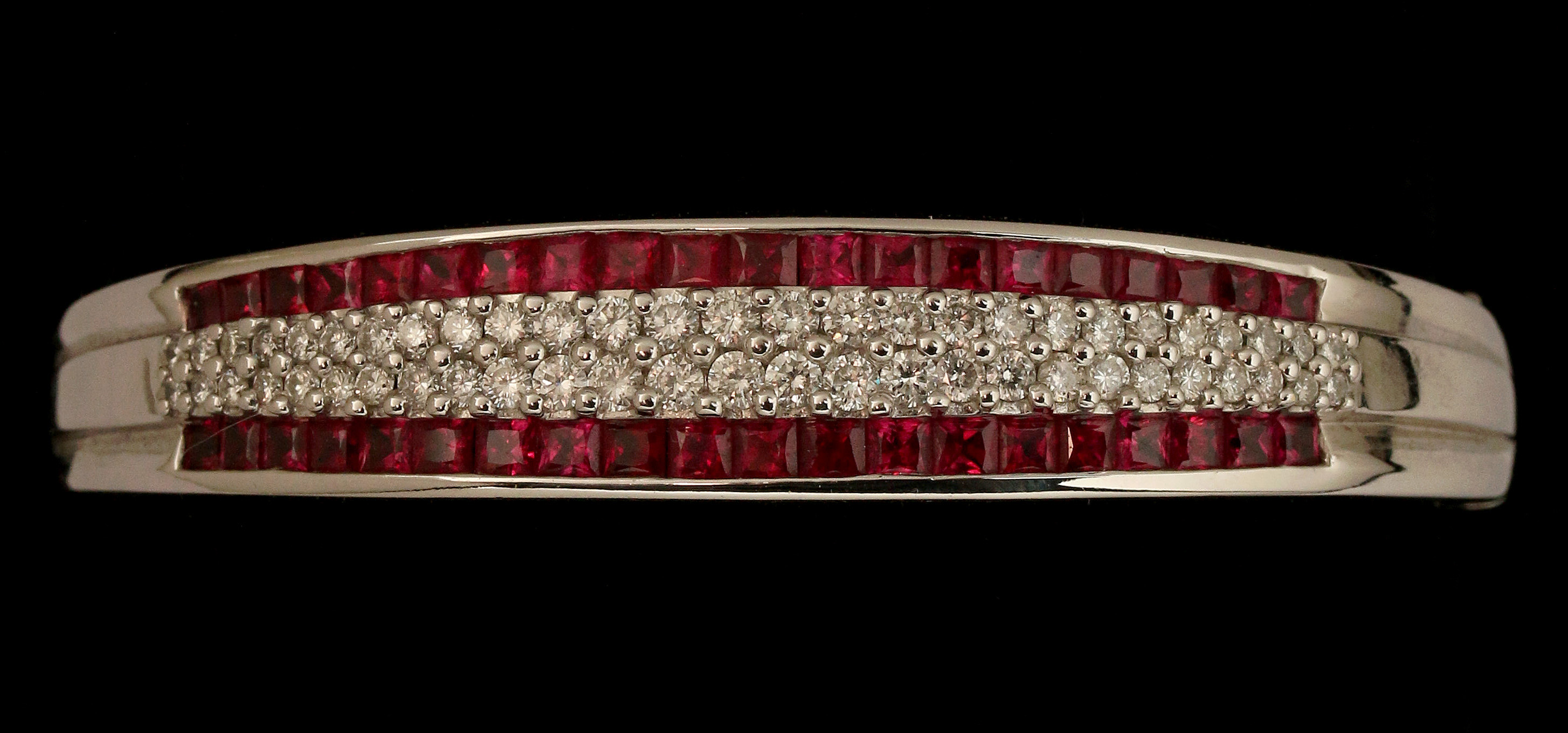 AN 18K WHITE GOLD DIAMOND AND RUBY BANGLE BRACELET