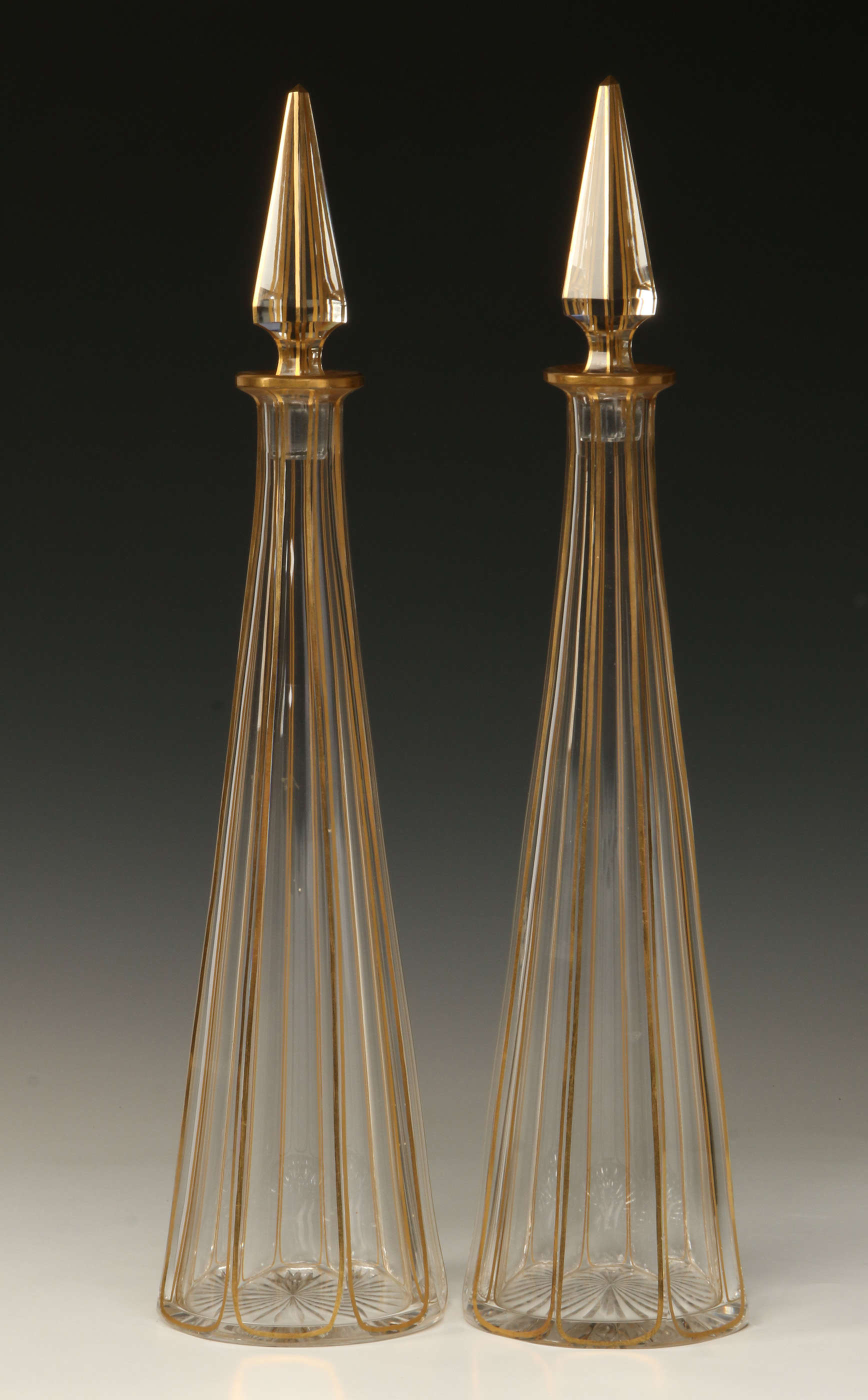 A PAIR 16-INCH PYRAMIDAL POLISHED CRYSTAL DECANTER