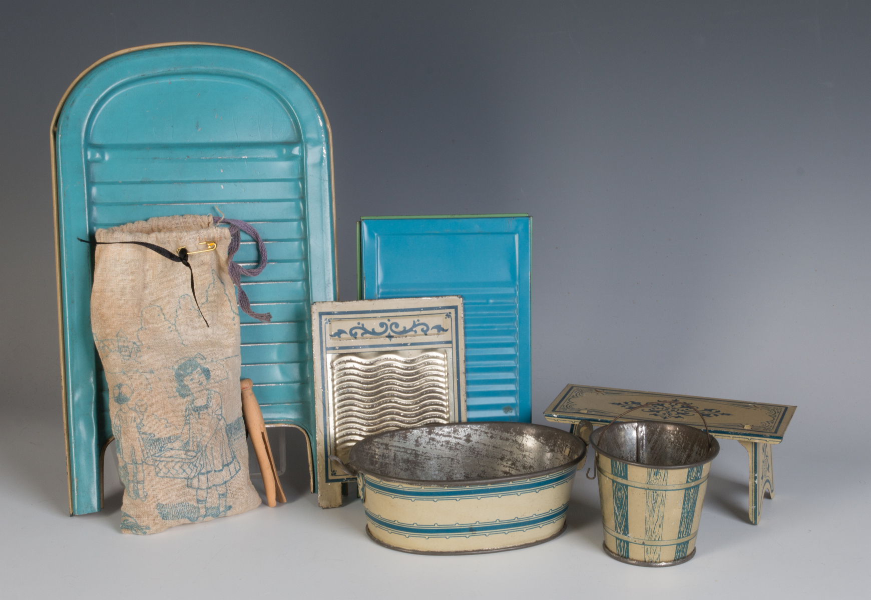 A COLLECTION OF TIN LITHO WASH DAY TOYS CIRCA 1910
