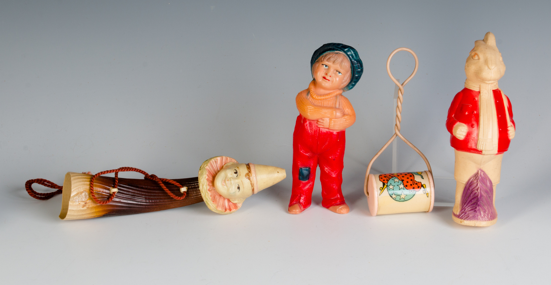 A COLLECTION OF CELLULOID RATTLES