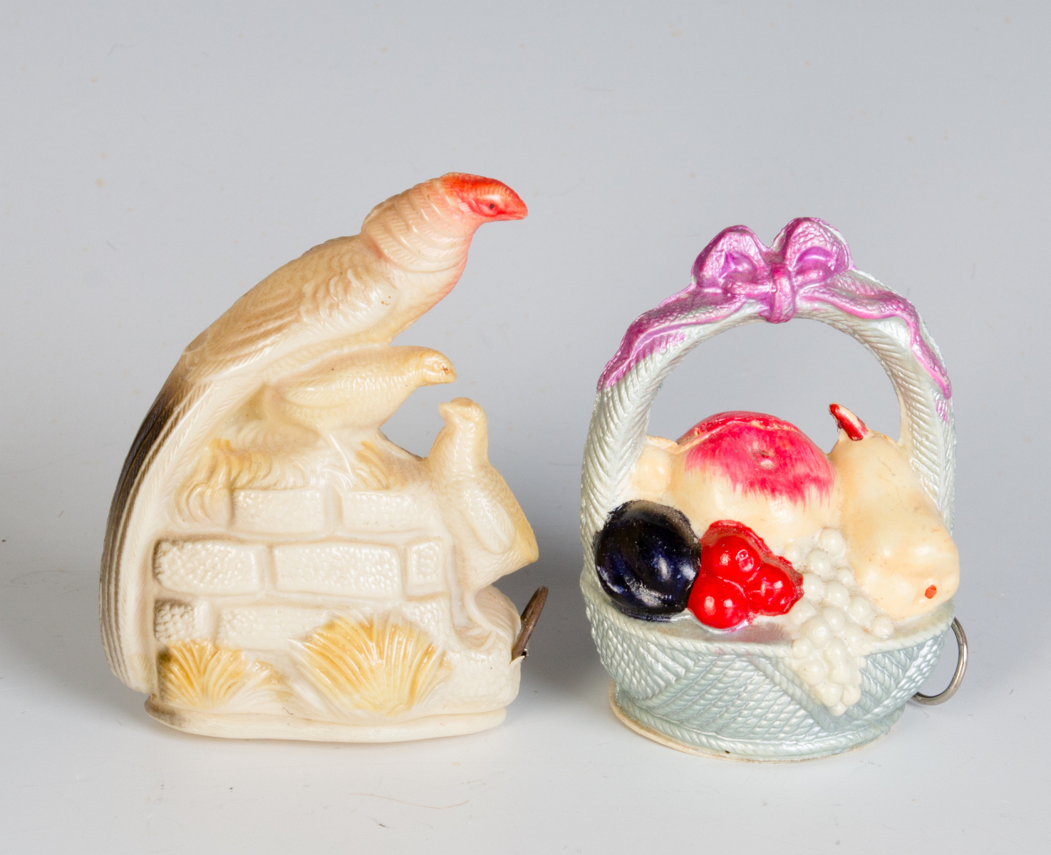 TWO VINTAGE CELLULOID TAPE MEASURES