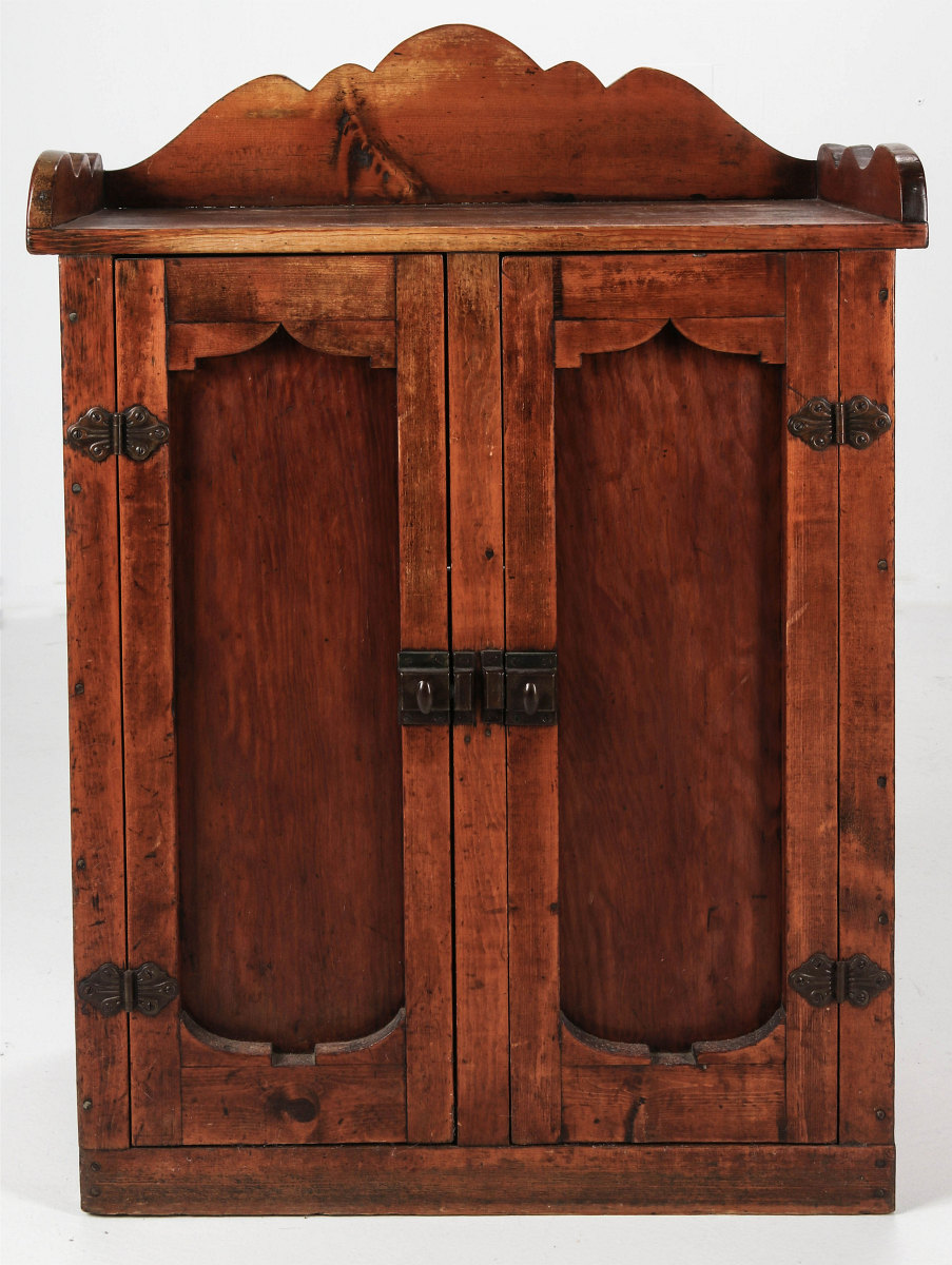 A SMALL FOLK ART TWO DOOR CABINET