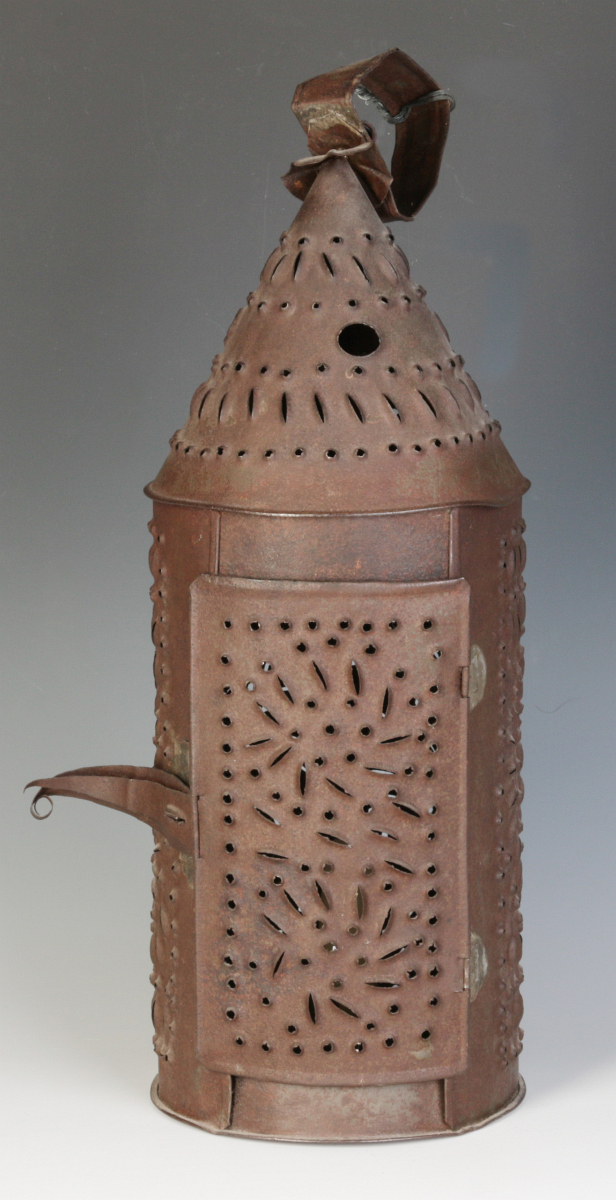 A 19TH CENTURY PIERCED TIN CANDLE LANTERN