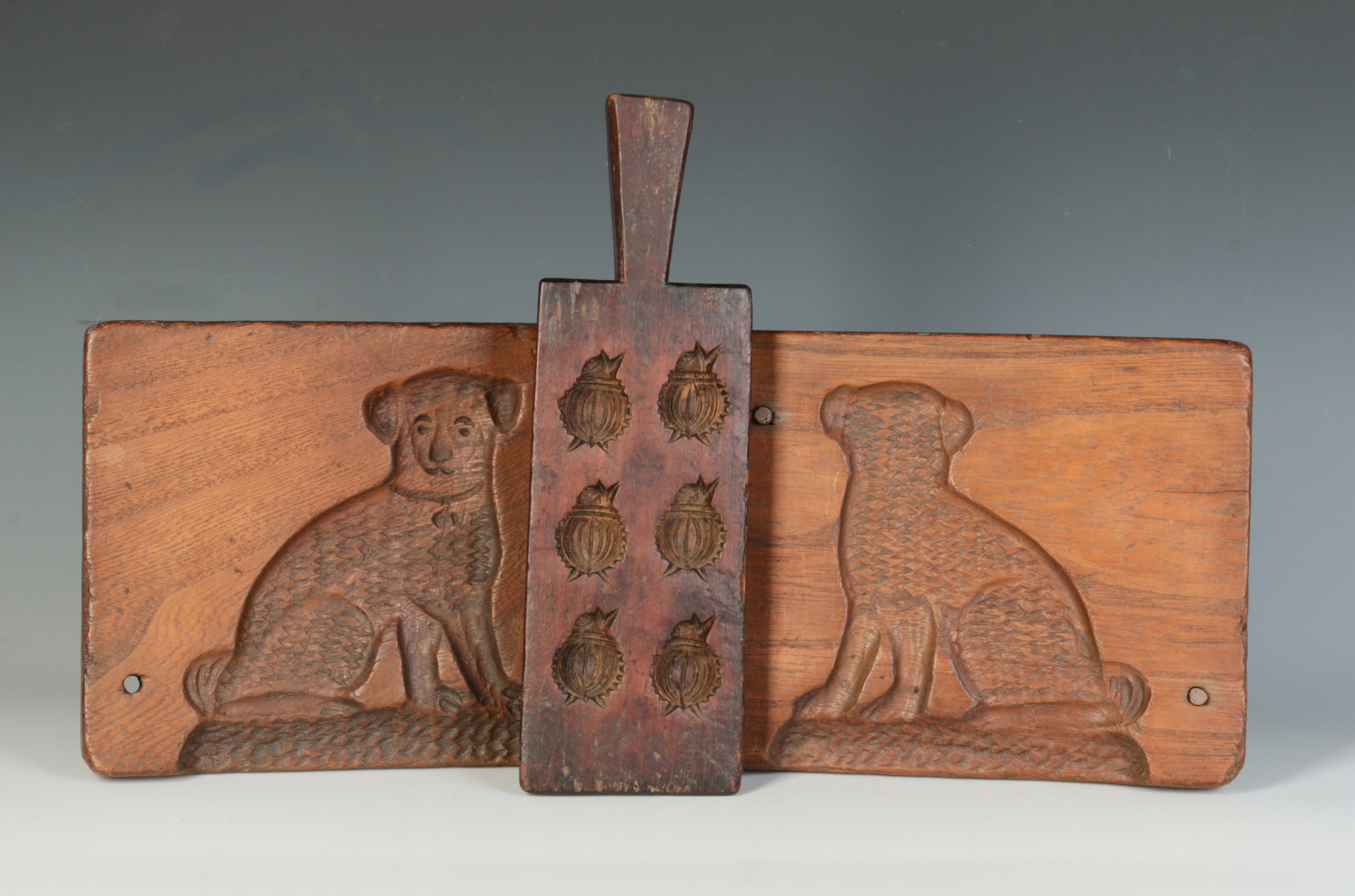 TWO 19TH CENTURY WOOD COOKIE BOARDS, ONE DOG