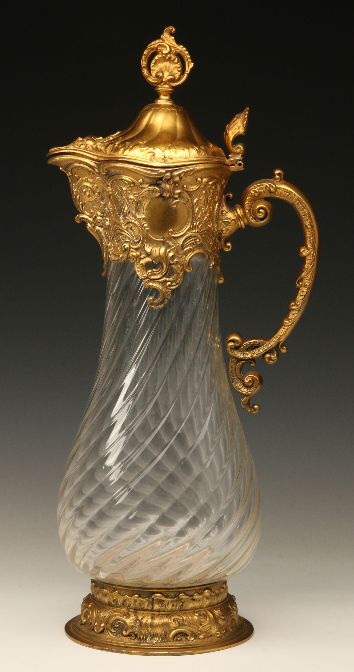 A CIRCA 1900 CRYSTAL FLAGON WITH GILDED METAL MOUN