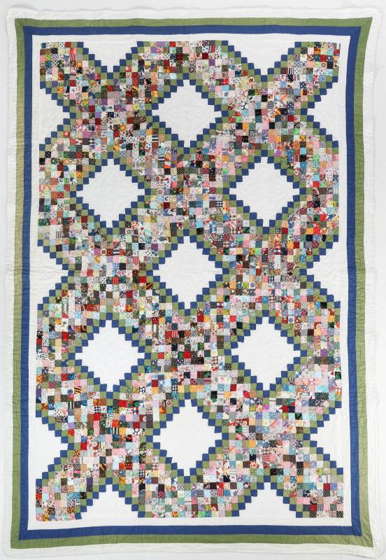 A VINTAGE 'POSTAGE STAMP IRISH CHAIN' QUILT