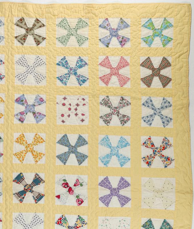 A 1930s 'MALTESE CROSS' FEEDSACK QUILT