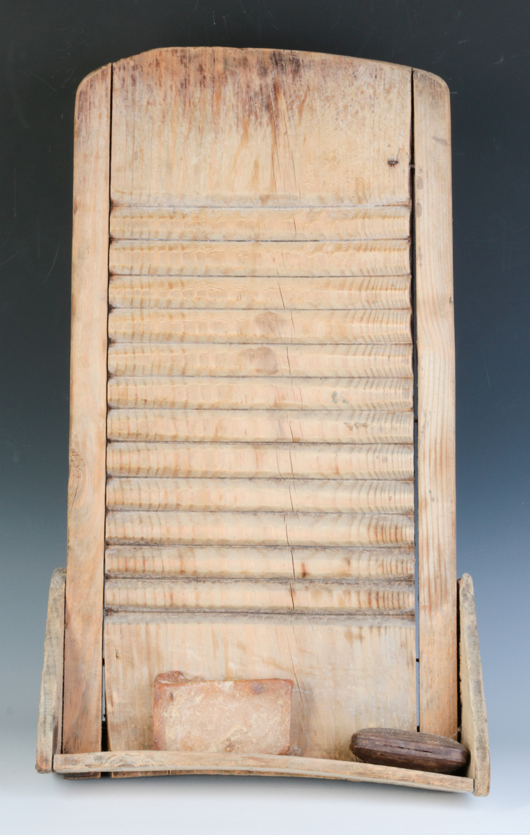 A 19TH CENTURY PRIMITIVE PINE SCRUB BOARD