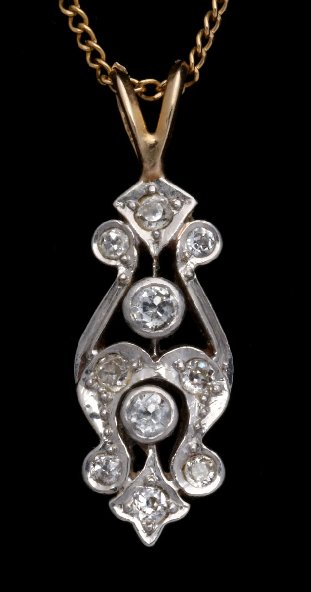 AN ANTIQUE 14K GOLD AND DIAMOND PENDANT