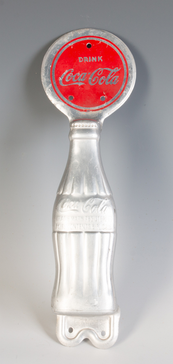 A COCA-COLA BOTTLE FORM DOOR PULL CIRCA 1930s