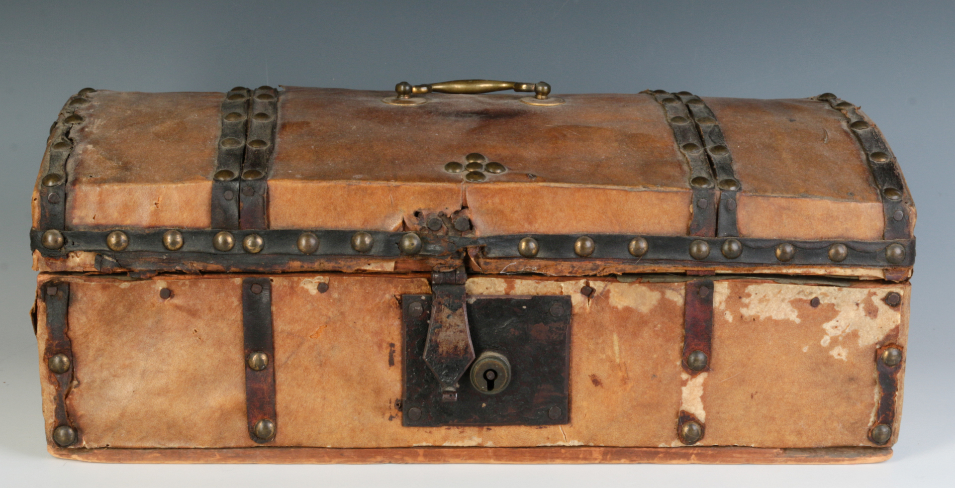 A SMALL EARLY 19TH C. HIDE COVERED DOME TOP BOX