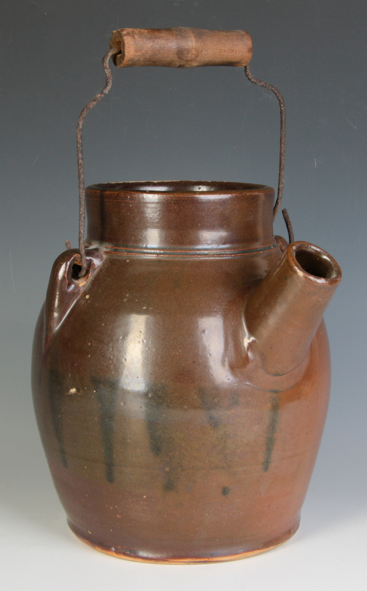 A MIDWESTERN ALBANY SLIP STONEWARE JUG