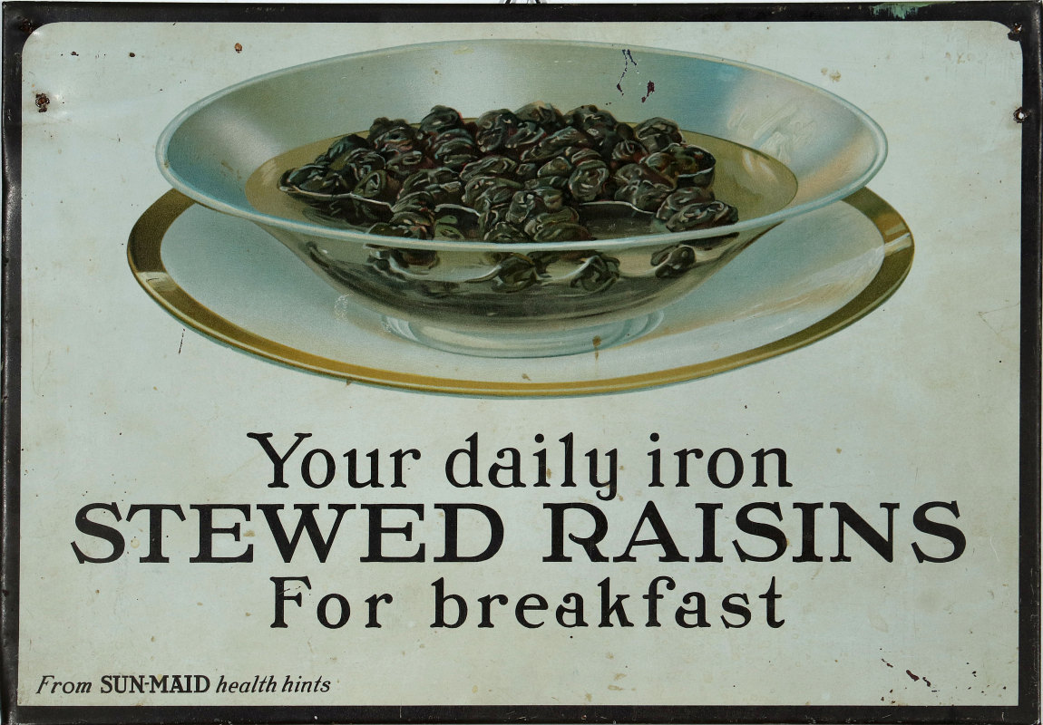 A 1920s SUN-MAID STEWED RAISINS TIN ADVTG SIGN