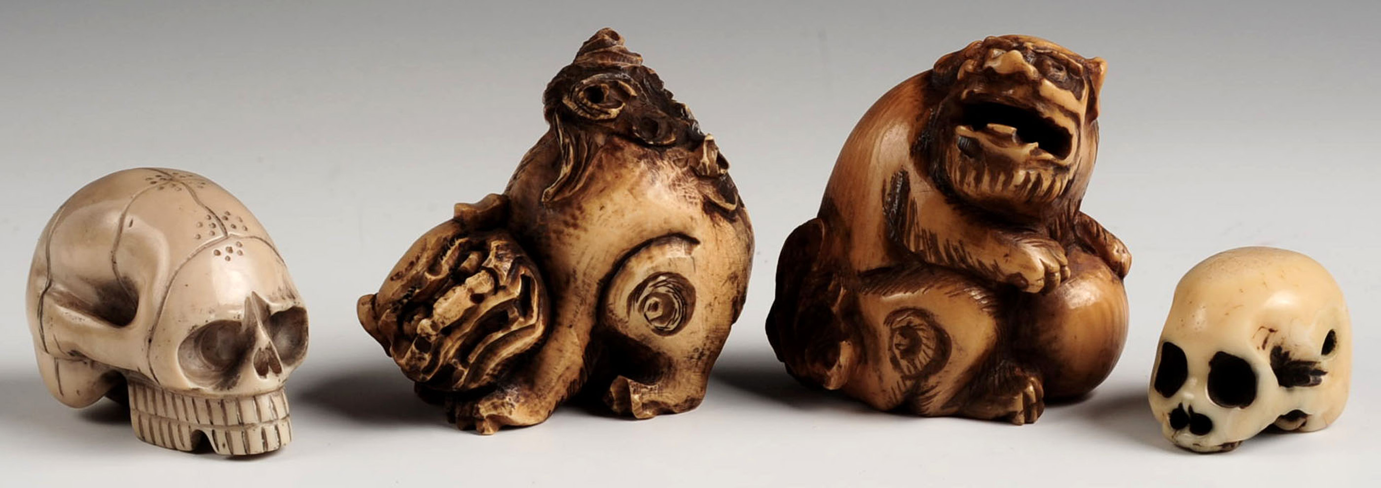 FOUR CARVED IVORY NETSUKE