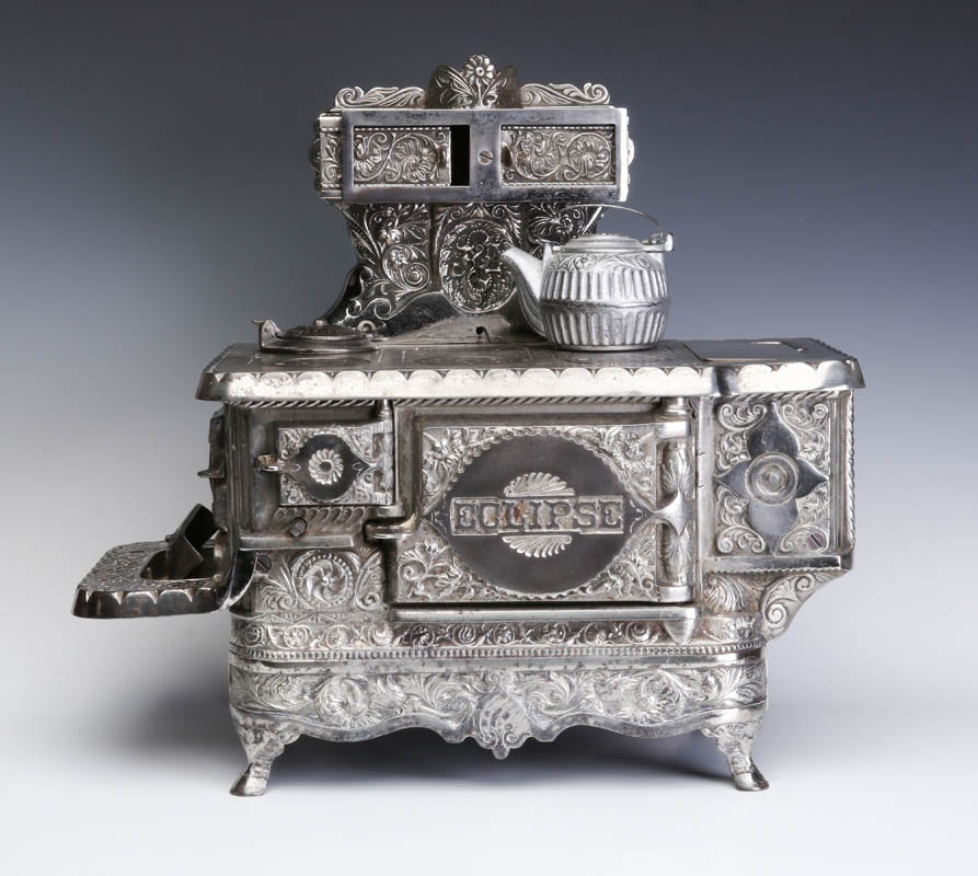 A J&E STEVENS 'ECLIPSE' ORNATE CAST IRON MIN STOVE