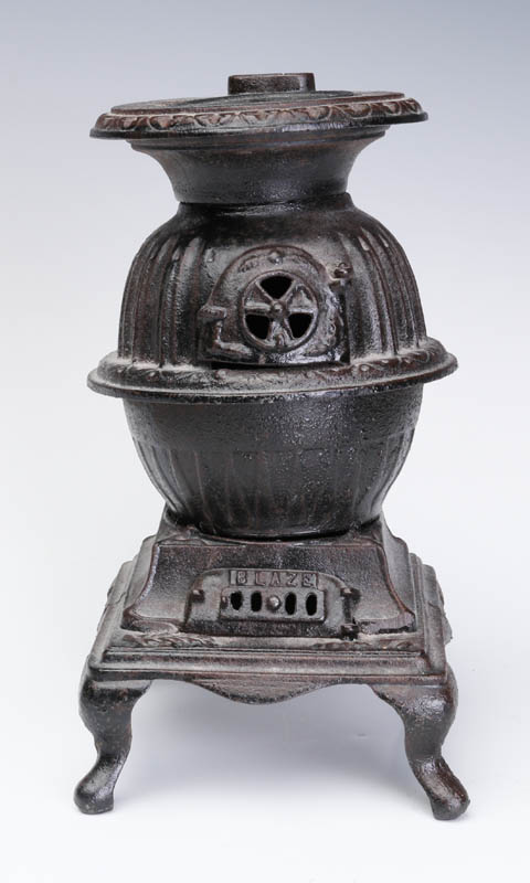 A VINTAGE 'BLAZE' CAST IRON POT BELLY TOY STOVE