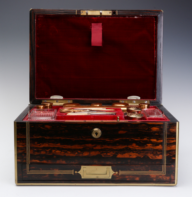 AN ENGLISH BRASS BOUND ZEBRA WOOD VANITY CASE