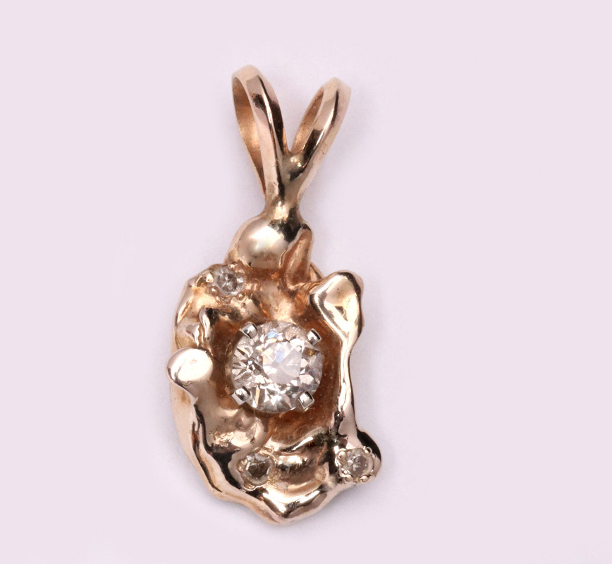 A CUSTOM 14K FREEFORM NUGGET PENDANT WITH DIAMOND