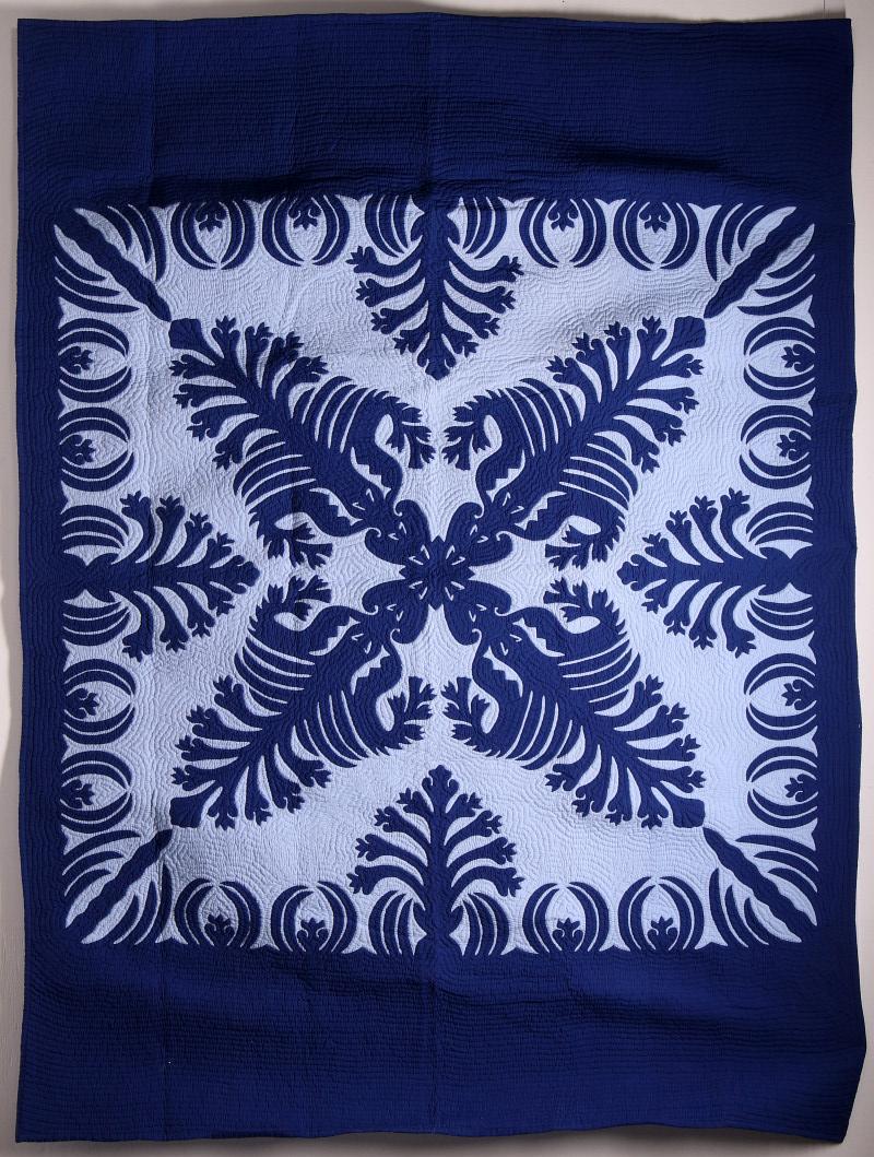 A LATE 20TH CENTURY HAWAIIAN APPLIQUE' QUILT