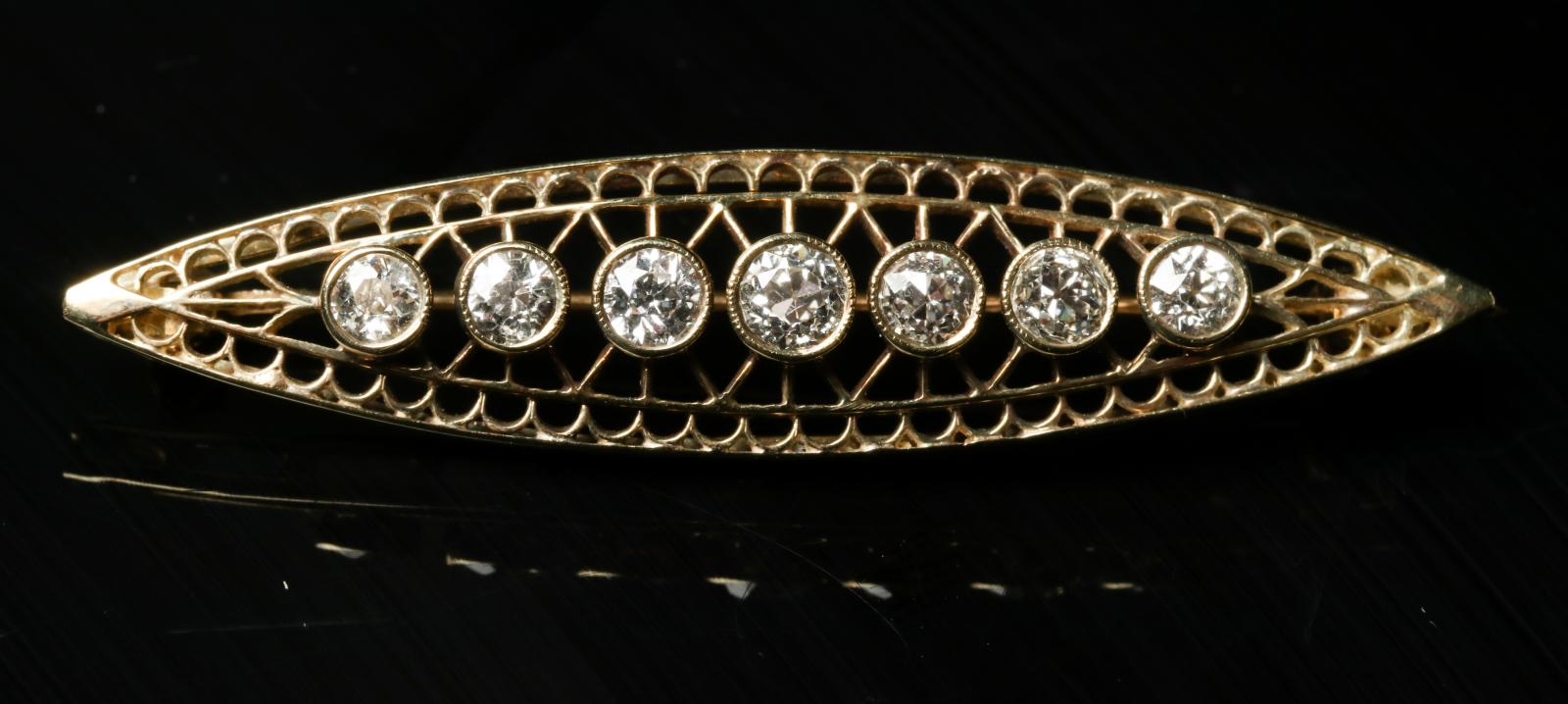 AN ANTIQUE 14K GOLD AND DIAMOND BAR PIN