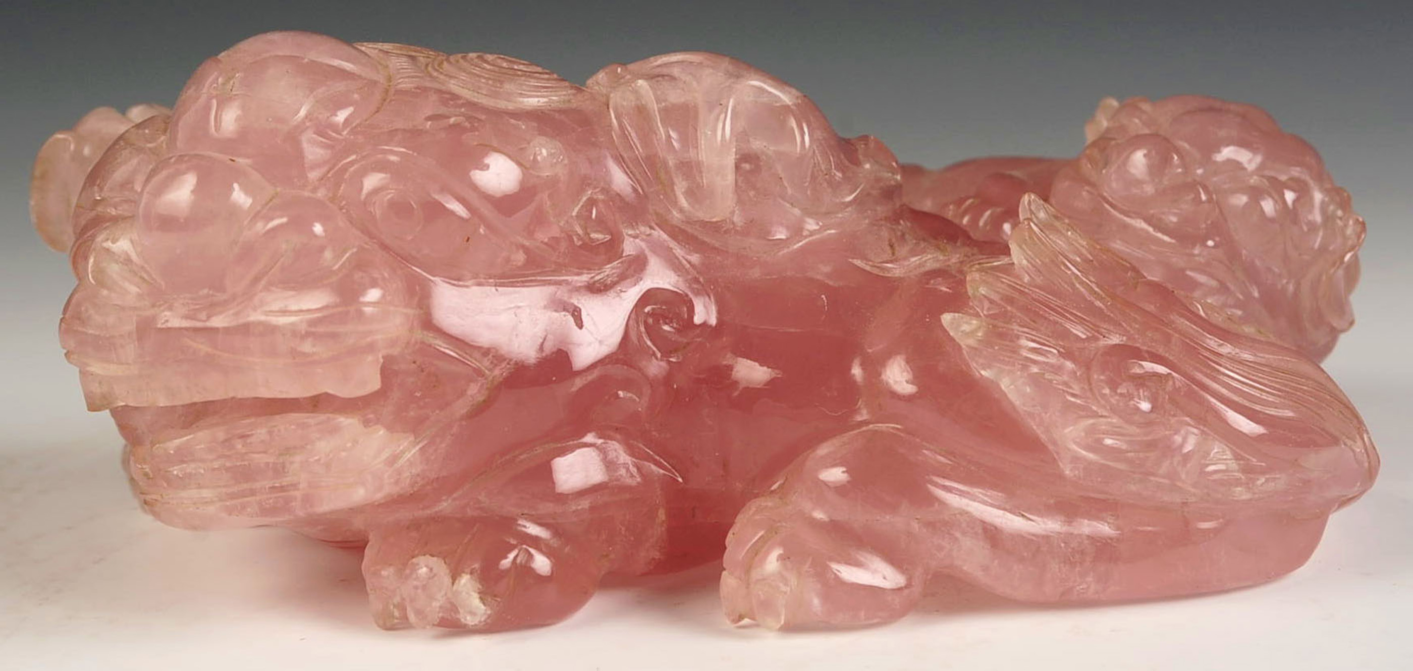 A CHINESE ROSE QUARTZ FU DOG CARVING