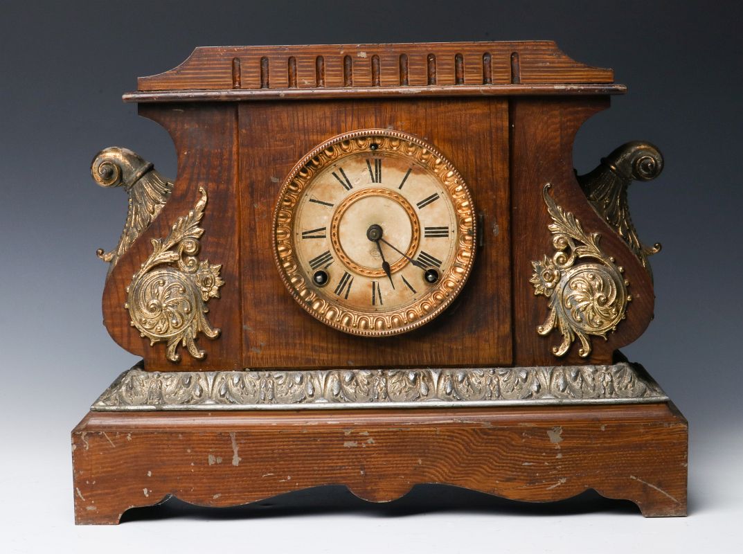 A GRAIN PAINTED IRON CASE ANSONIA MANTLE CLOCK