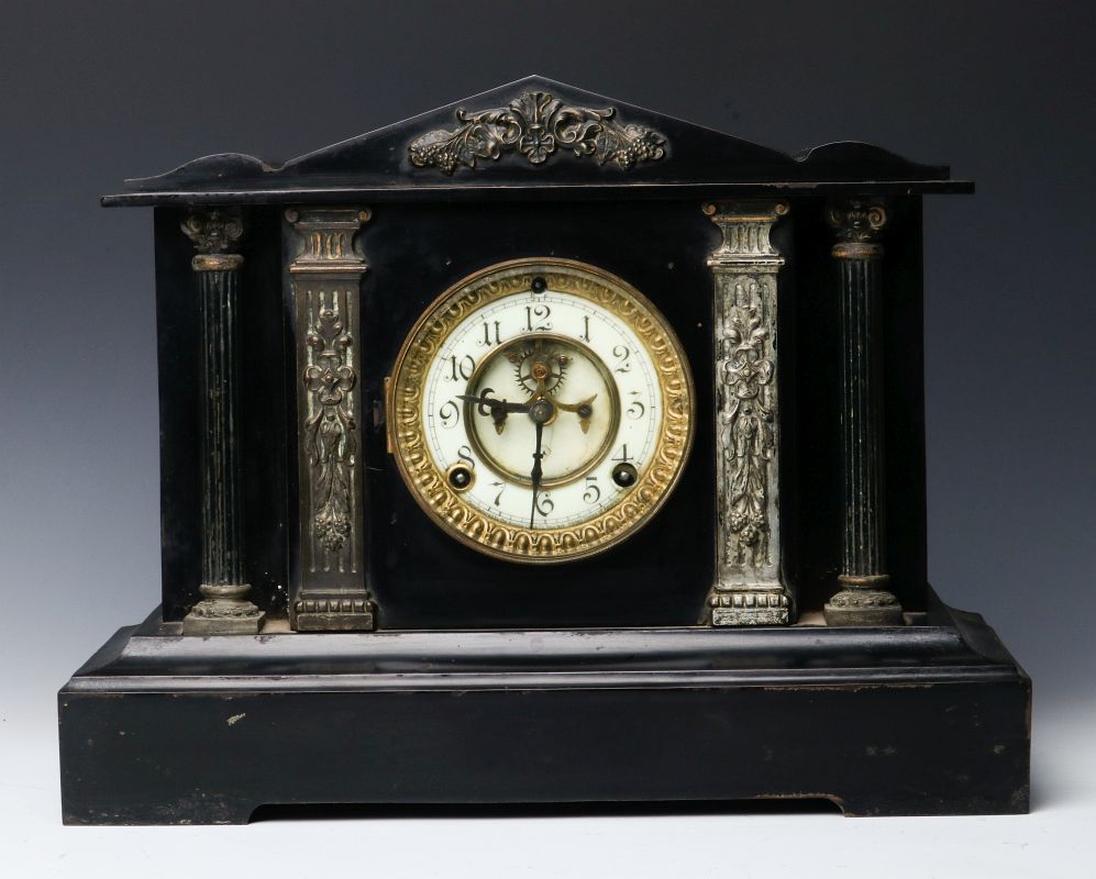 AN ANSONIA 'CORINTH' IRON CLOCK WITH HALF COLUMNS